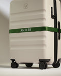 a luggage with a green band
