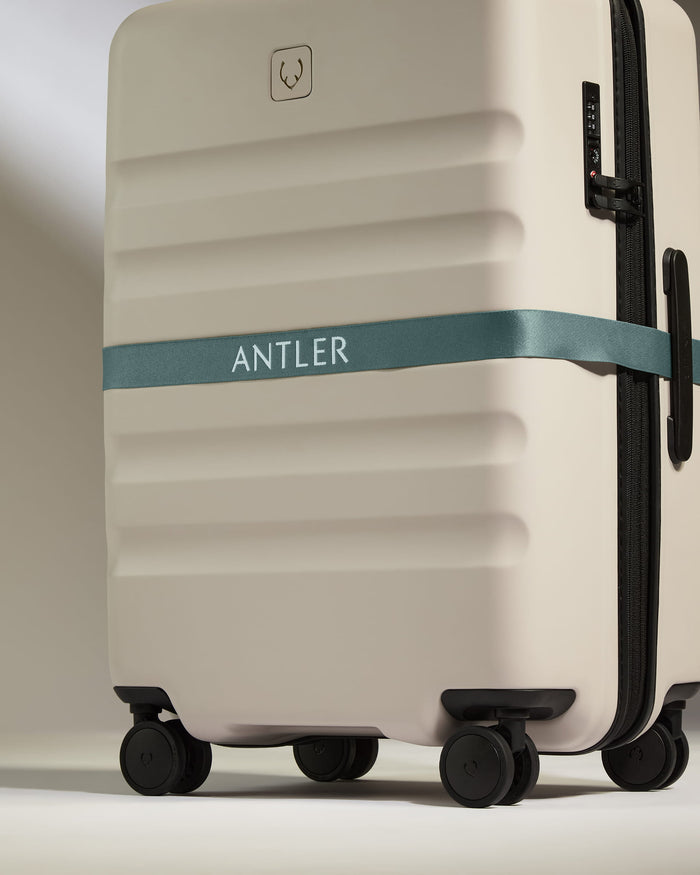 a luggage with a ribbon around it