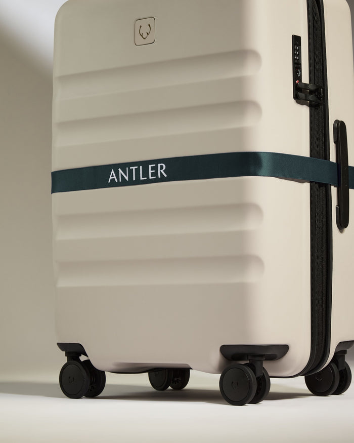 a luggage with a ribbon around it