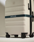 a luggage with a ribbon around it