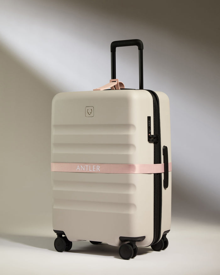 a luggage with a tape around it