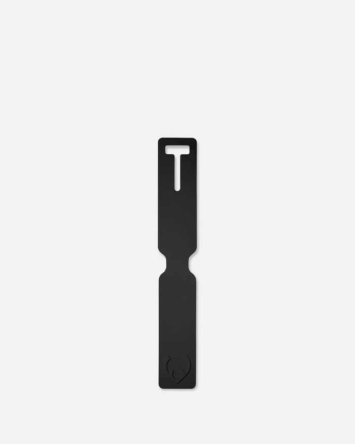 a black rectangular object with a white t