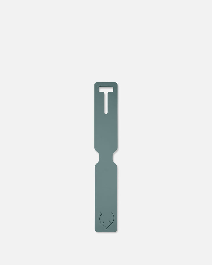 a grey rectangular object with a hole in the middle