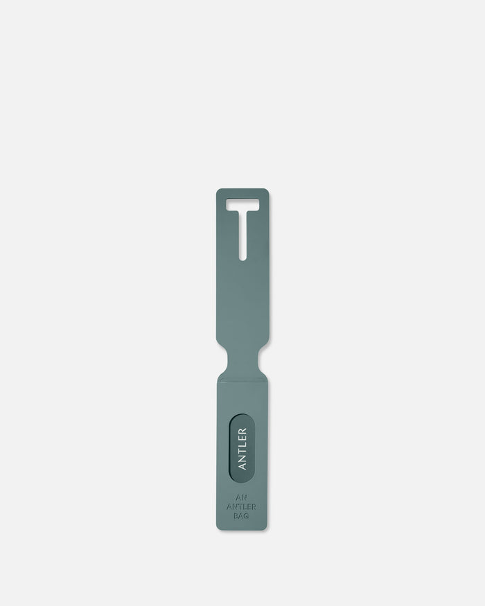 a grey metal tool with a hole in the middle