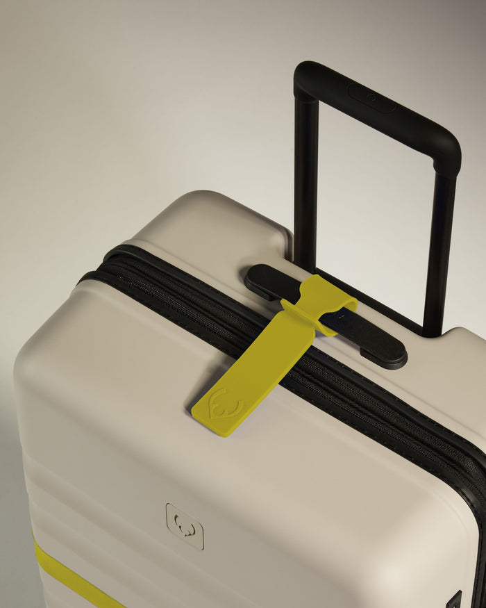 a luggage with a yellow tag on it
