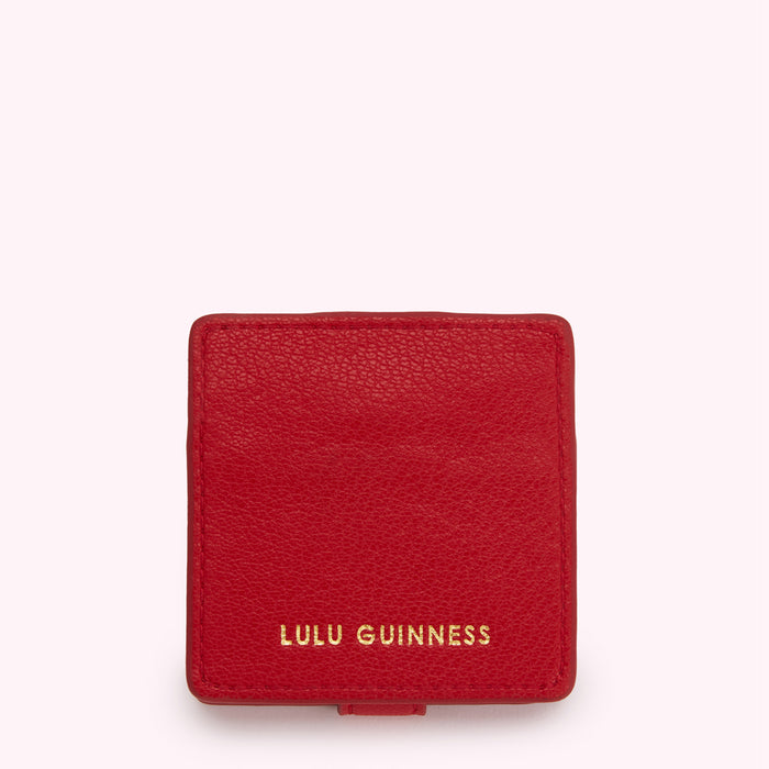 Red Lulu Guinness compact.