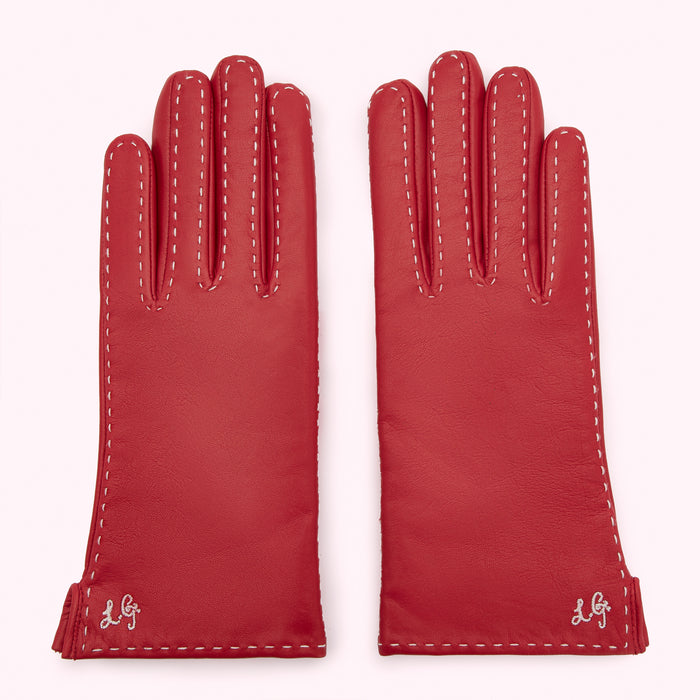 Pair of red leather gloves with white stitching and embroidered logo.