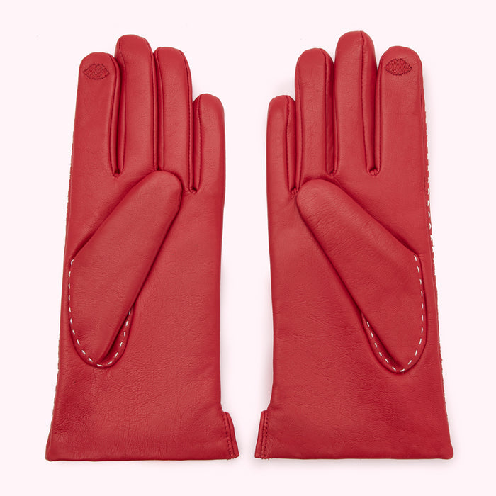 Pair of red leather gloves with white stitching.