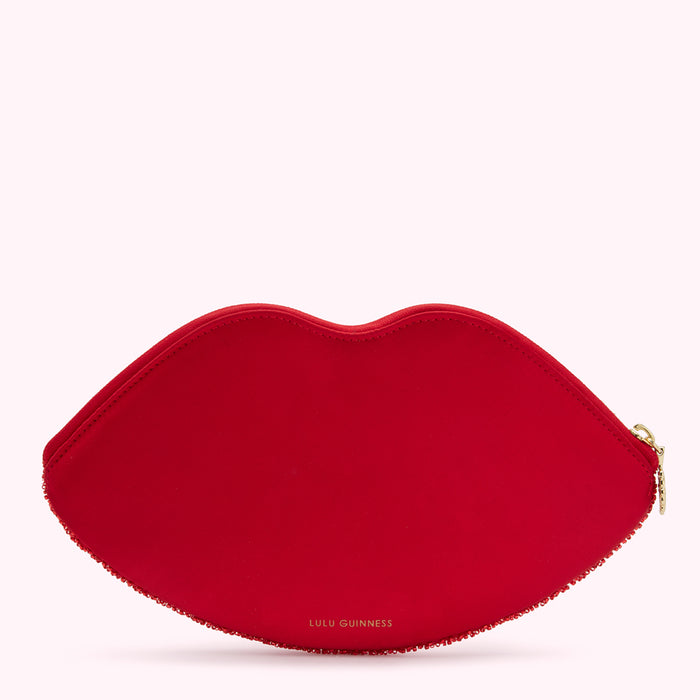 Red lip-shaped clutch by Lulu Guinness.