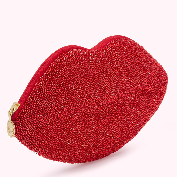 Red beaded lip-shaped clutch.