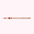 Beige and red Lulu Guinness shoulder strap with the brand name printed on it.
