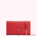 Red leather wallet on a white background with a gold chain strap.