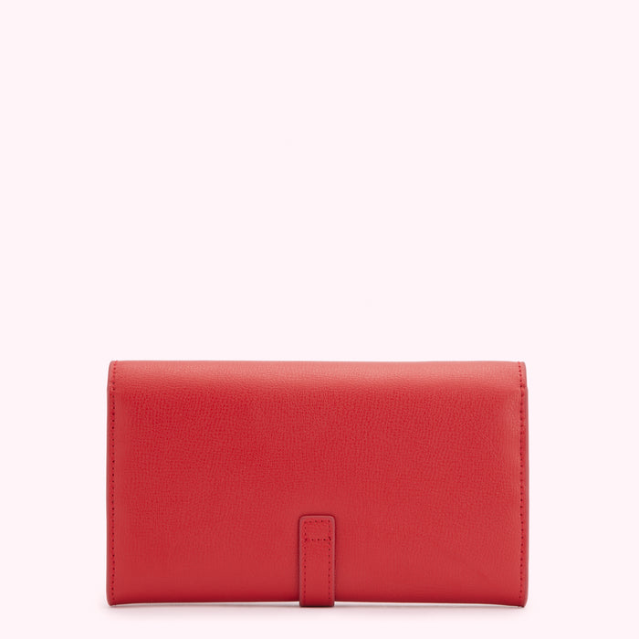 Red leather wallet on a white background.