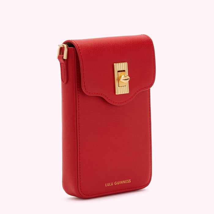 Red Lulu Guinness phone crossbody bag with gold clasp.