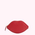 Red leather lip-shaped zipper pouch on white background.