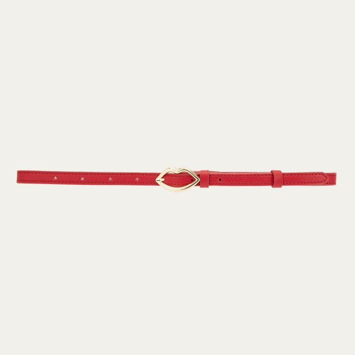 Red leather belt showing a gold lip shaped buckle.