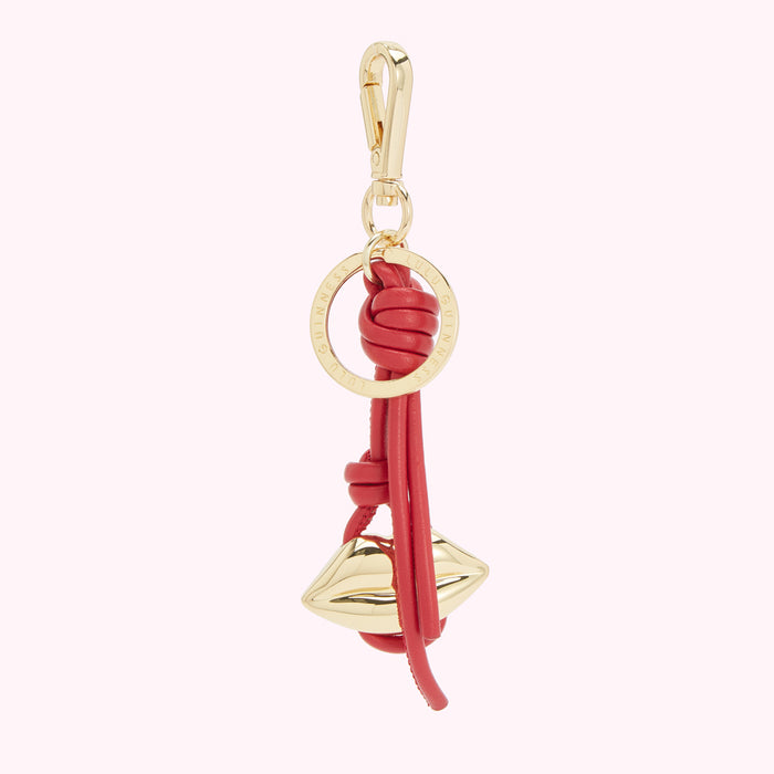 Red leather Lulu Guinness keyring with gold lip charm and logo.