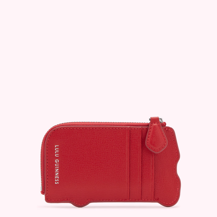 Red Lulu Guinness bus-shaped zip-around cardholder against a white background.