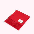 Red Lulu Guinness wool scarf with a fringe and a small label.