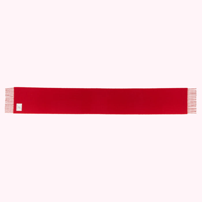A solid red scarf with frayed edges.