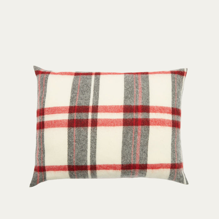 Rectangular pillow with a red and grey plaid or tartan pattern on a cream background.