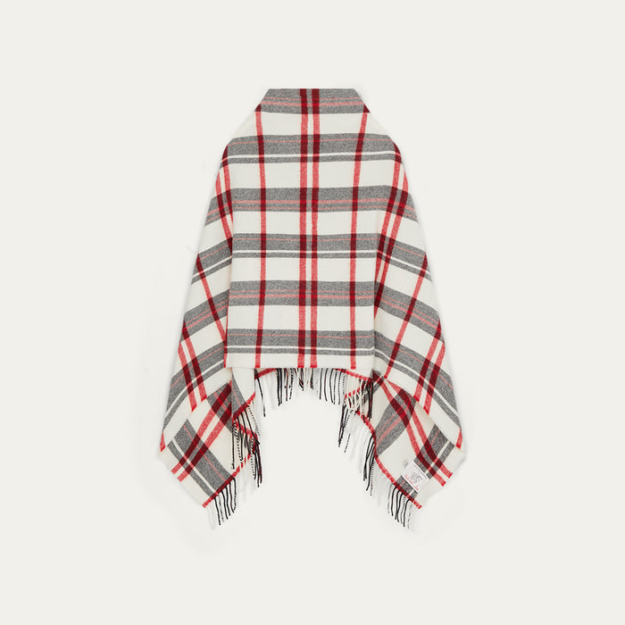 Plaid poncho with red, gray, and white pattern on a light gray background