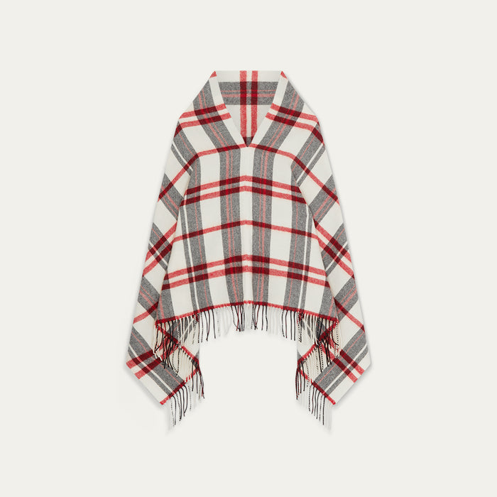 Plaid poncho with fringes on a white background