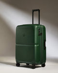 a green suitcase with wheels