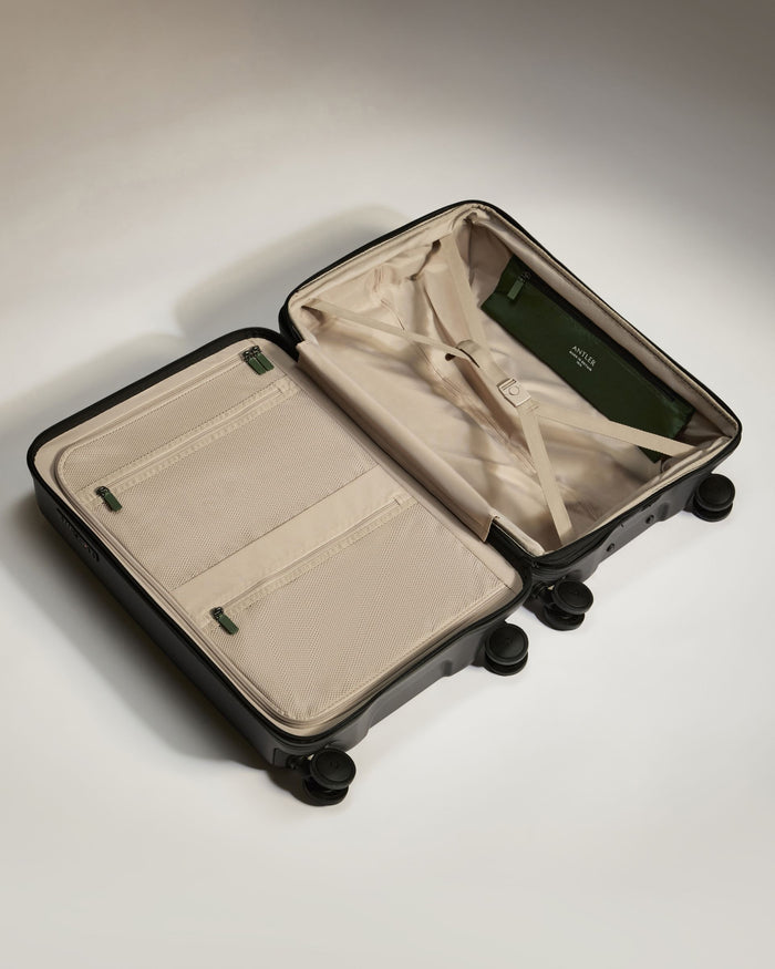 a suitcase with wheels and a cloth inside