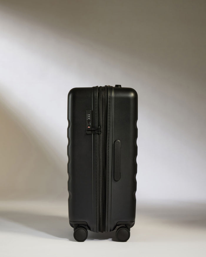 a black suitcase with wheels