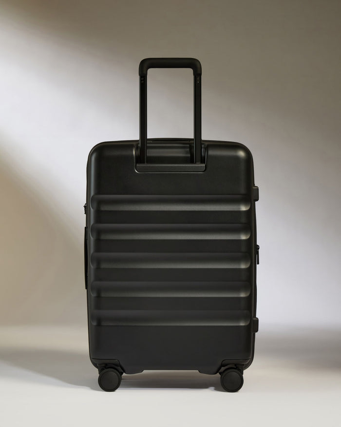 a black suitcase with wheels