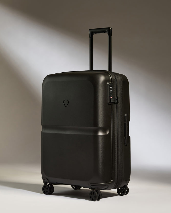 a black suitcase with wheels