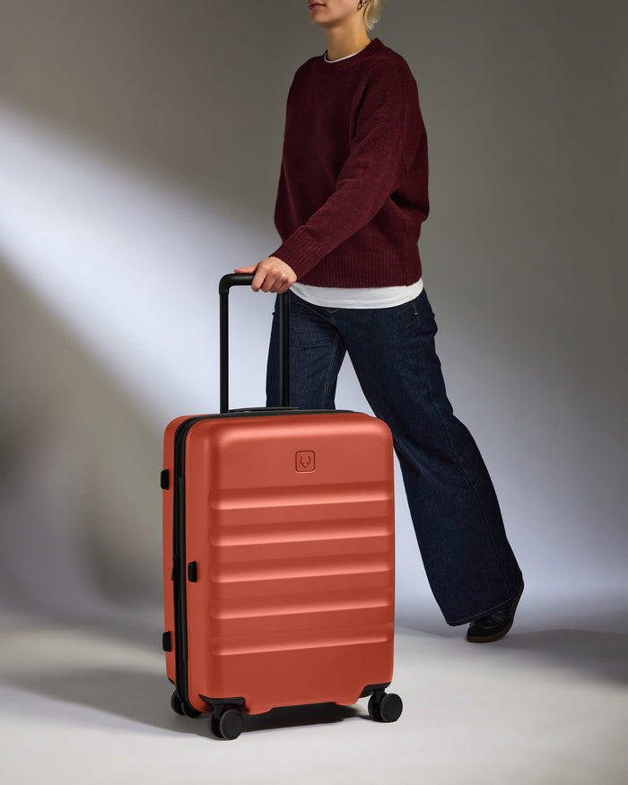 a person pulling a suitcase