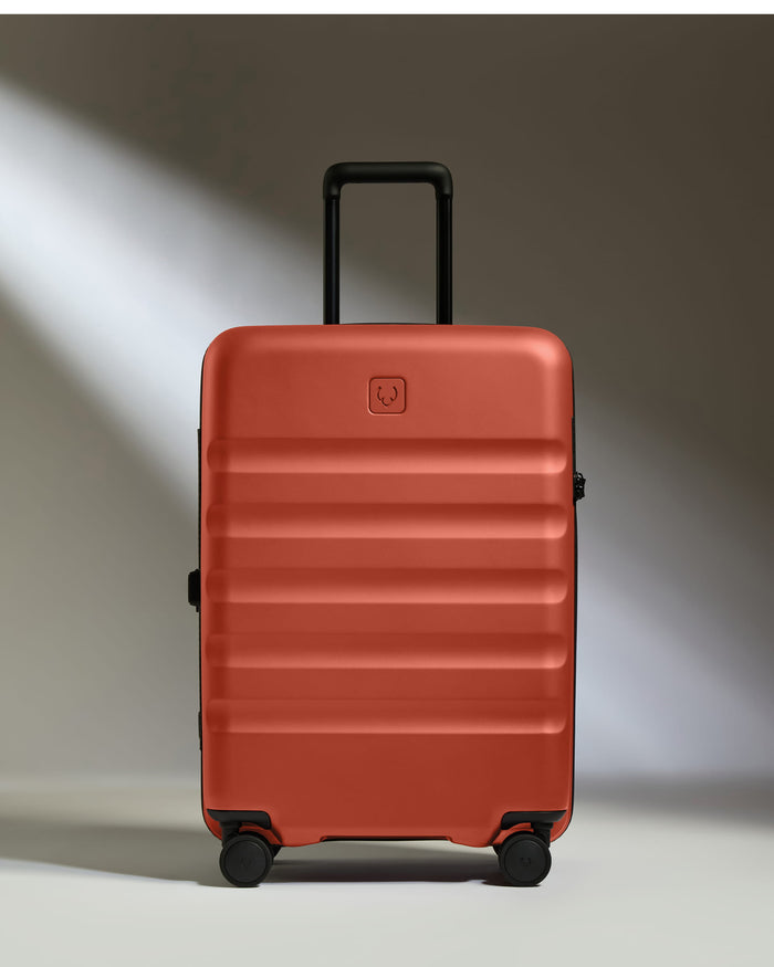 a red suitcase with wheels