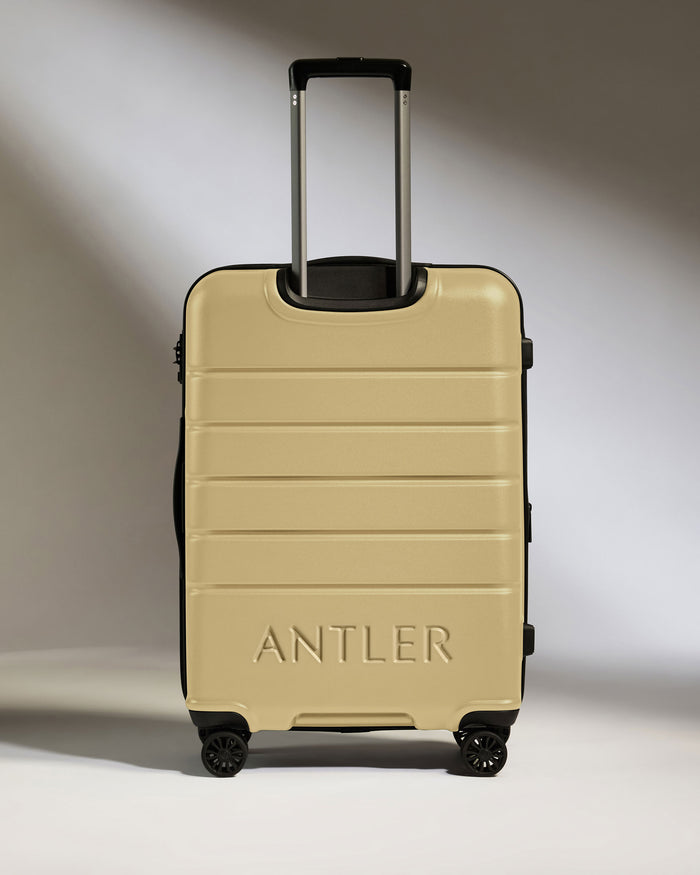 a tan suitcase with handles