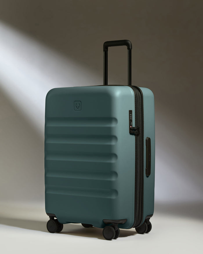 a blue suitcase with wheels