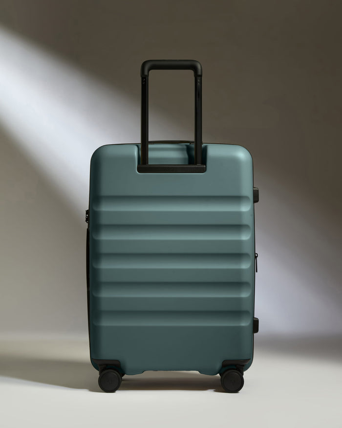 a blue suitcase with a handle