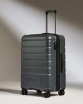 a grey suitcase with wheels