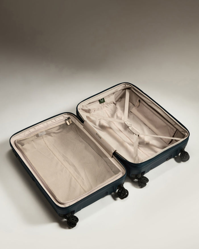 a suitcase with wheels and a lid