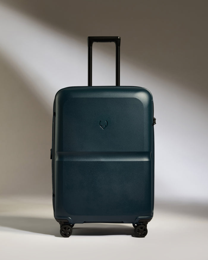 a blue suitcase with wheels