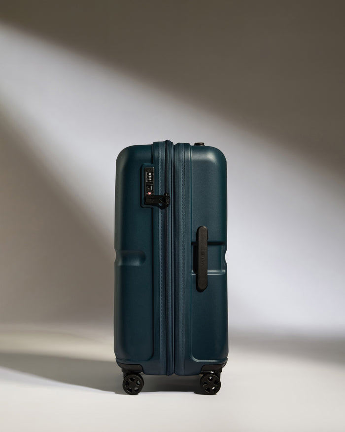 a blue suitcase with wheels