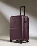 a purple suitcase with wheels