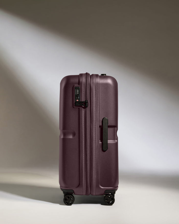 a purple suitcase with wheels