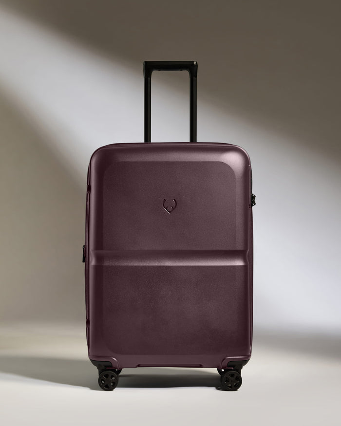 a purple suitcase with wheels