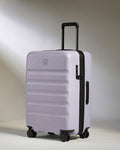 a purple suitcase with wheels
