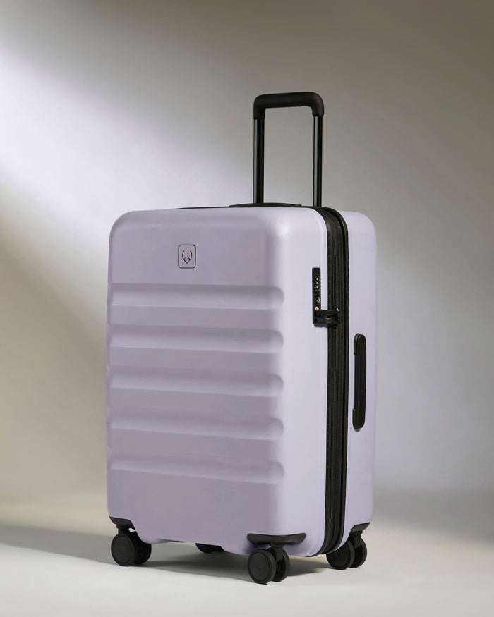 a purple suitcase with wheels