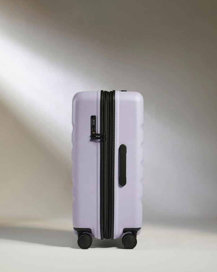 a purple suitcase with wheels