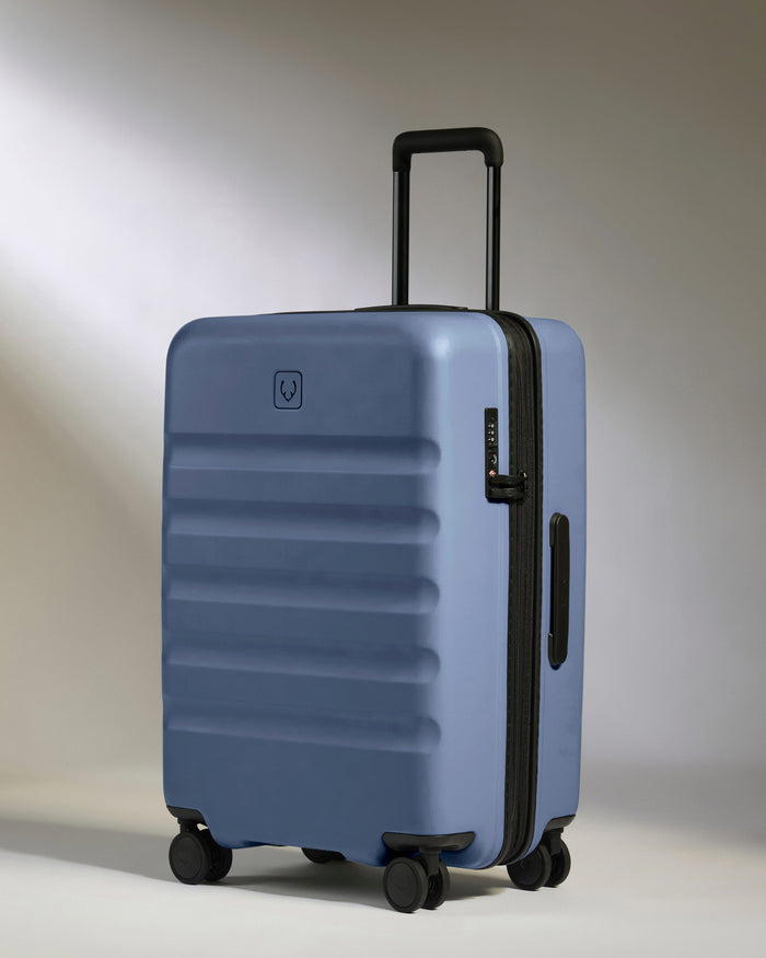 a blue suitcase with wheels