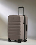 a grey suitcase with wheels