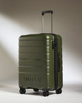 a green suitcase with wheels